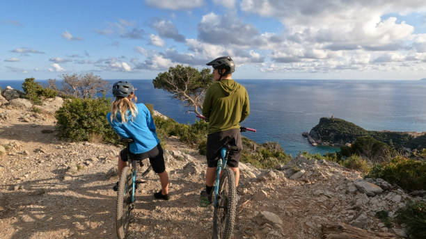 istock E-mountain bicyclists pause on mountain top 2150398582