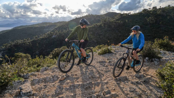 istock E-mountain bicyclists pause on mountain top 2150398698