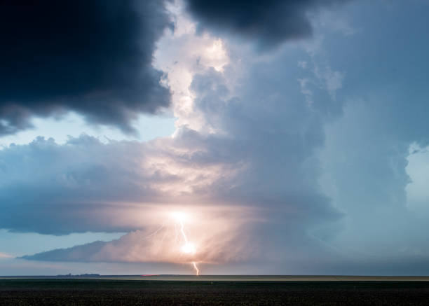 istock Big Storm Cloud Lit Up By Bright Lightning Bolt 2150399440