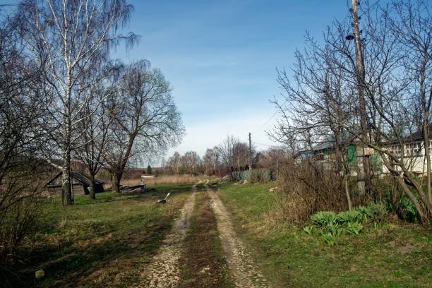 istock Dirt road through the village 2150400441