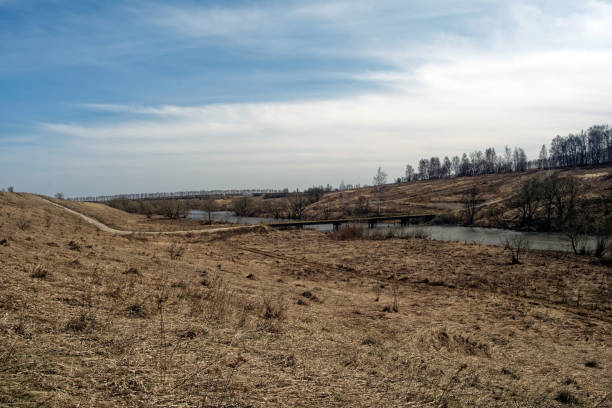 Bank of a small river in early spring, Russia