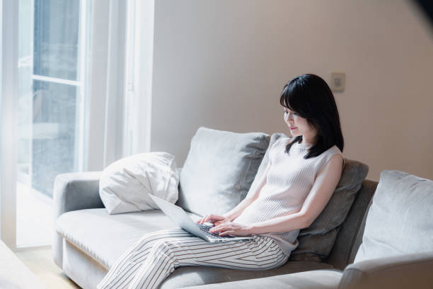 istock Young woman working from home 2150406427
