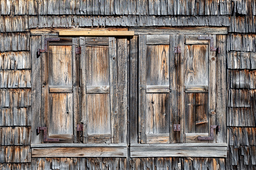 Window in the timbered wall with shutters