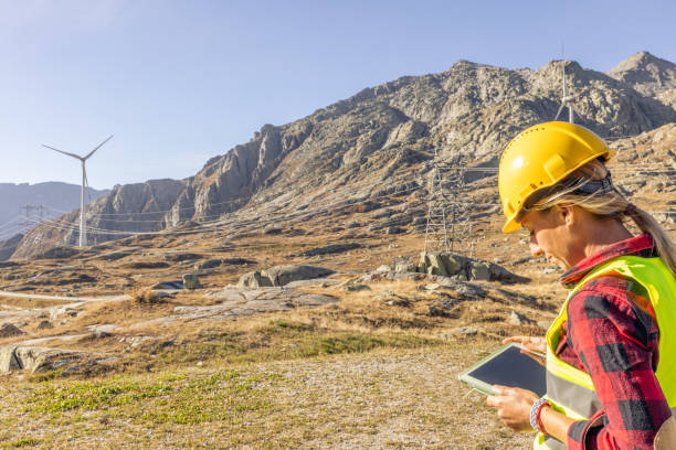 istock Female engineer planning on wind turbine maintenance work, natural renewable energy concept, wind power 2150408202