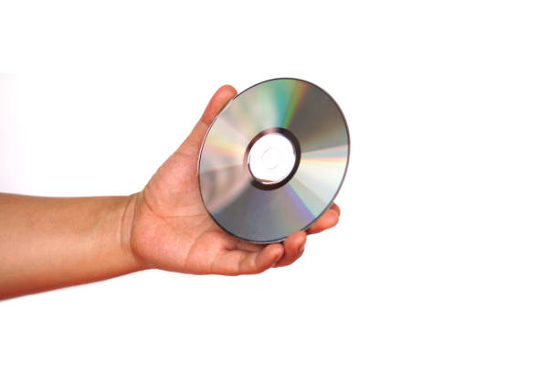 istock Close up hand hold CD compact disc, DVD, isolated on white background. Concept, tool, equipment for setup or install programs in computer or music, movie for dvd player. 2150408606