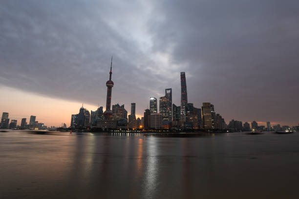 Shanghai, China. January 7, 2025. cargo ships transiting the Huangpu River in the city center