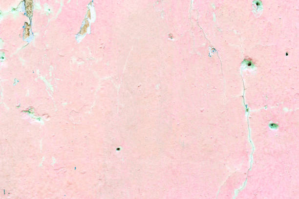 The weathered pink painted cement wall background