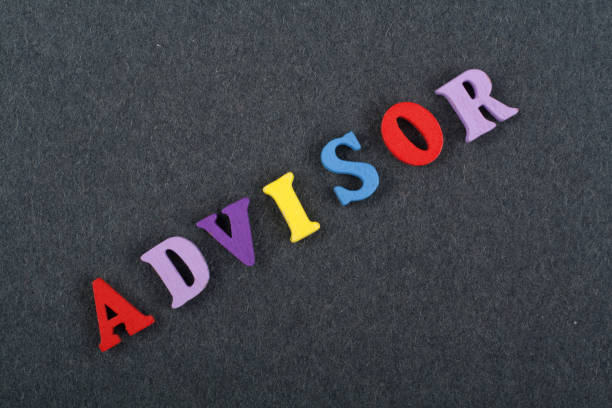 istock ADVISOR word on black board background composed from colorful abc alphabet block wooden letters, copy space for ad text. Learning english concept. 2150411792