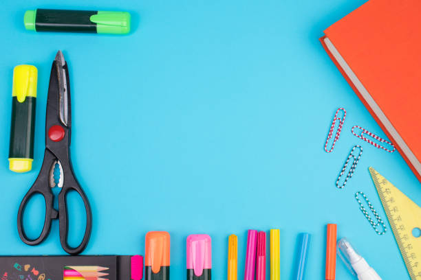 istock Back to school. Stationery on a blue table. Office desk with copy space. Flat lay. 2150411866