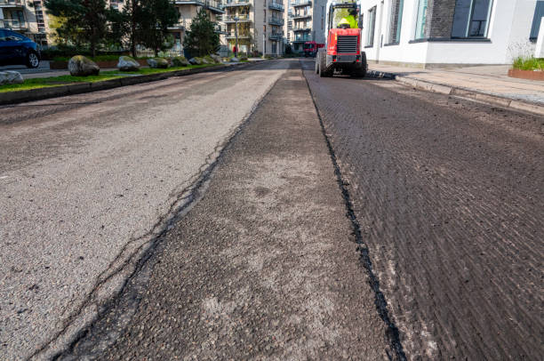 Damaged road prepared by  asphalt milling and grinding scraper machine for road repair. Street renewal with heavy machinery equipment.