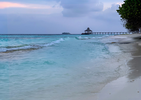 Maldive sunset landscape, coast line with resort. High quality photo