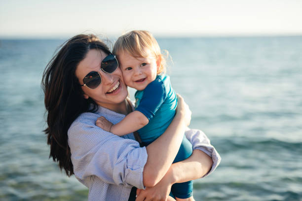 istock Fun day at the beach with mommy. 2150419282