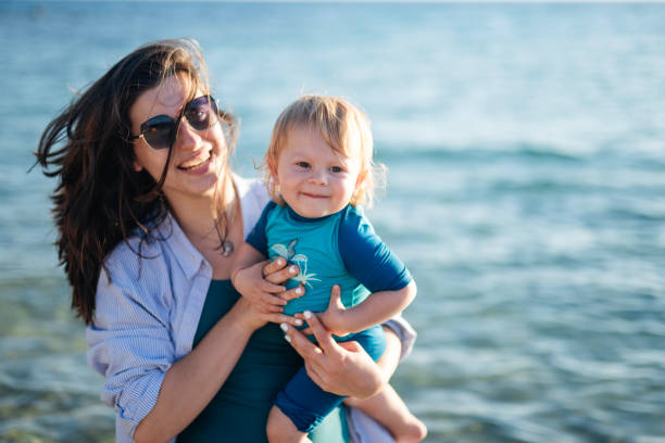istock Fun day at the beach with mommy. 2150419294