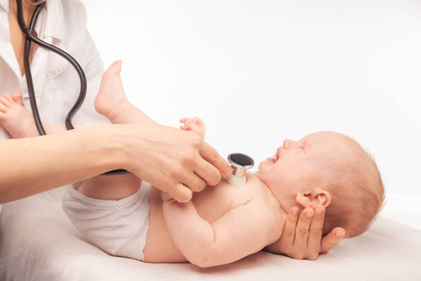 istock Pediatric Check-up Doctor Examining a Crying Baby with Stethoscope 2150423267
