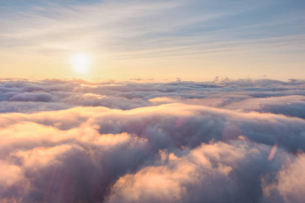 istock Sunlight breaks through cloudy sky, illuminating the landscape 2150424541