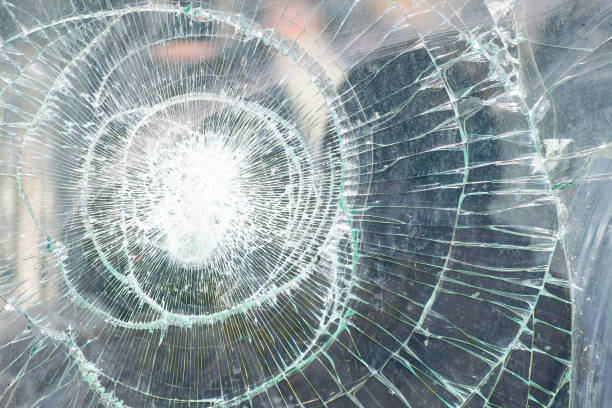 istock broken glass close-up. vandalism. 2150425909