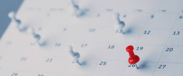 istock Embroidered red pins on a calendar event Planner calendar,clock to set timetable organize schedule,planning for business meeting or travel planning concept. 2150426920