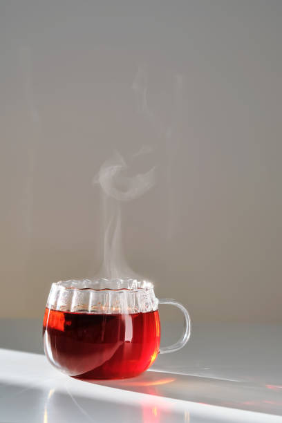 istock Glass mug with hot black tea on the table. 2150428349