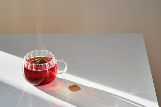 istock Glass mug with hot black tea on the table. 2150428369