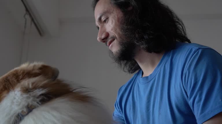 Latin Man's Leisurely Bonding Time with His Canine Companion., Slow motion, copy space.