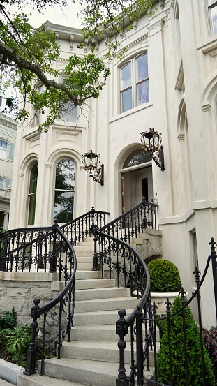 Savannah GA April 2024 Stately elegant home in the Historic District  shaded by Live oak trees and lush greenery