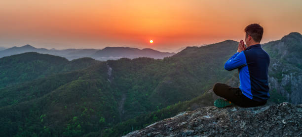 Meditation on the mountaintop under the sunset