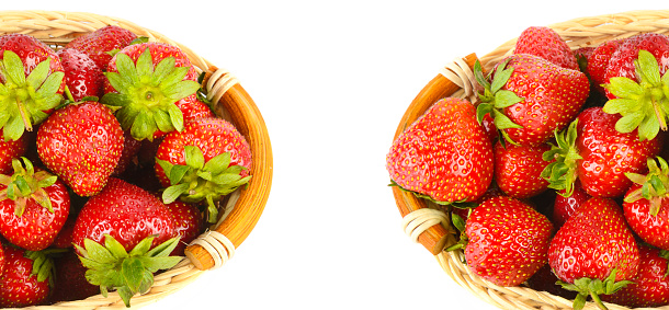 Ripe strawberries in a basket isolated on white background. There is free space for text. Collage. Wide photo.