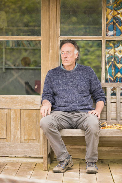 istock Senior man relaxing outside his garden room 2150438352