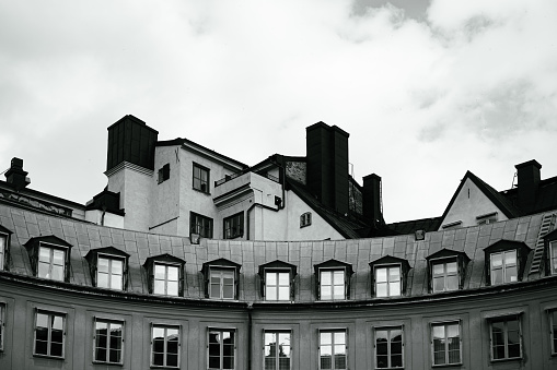 Low angle view of buildings in black and white