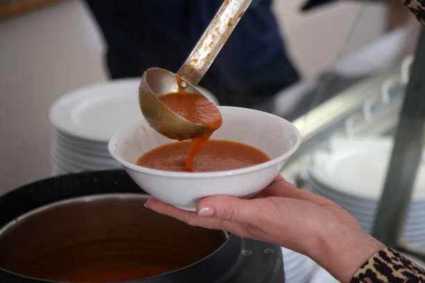 istock Woman taking soup from a buffet line 2150443724