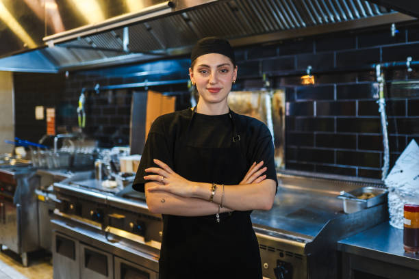 istock Young woman's first day working at a burger restaurant 2150449761