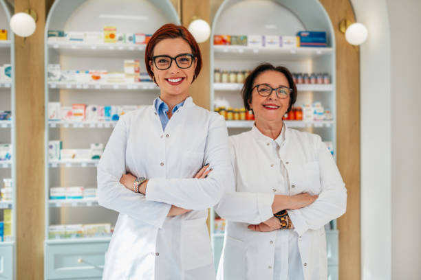 istock Two female pharmacists posing in a drugstore. 2150451288
