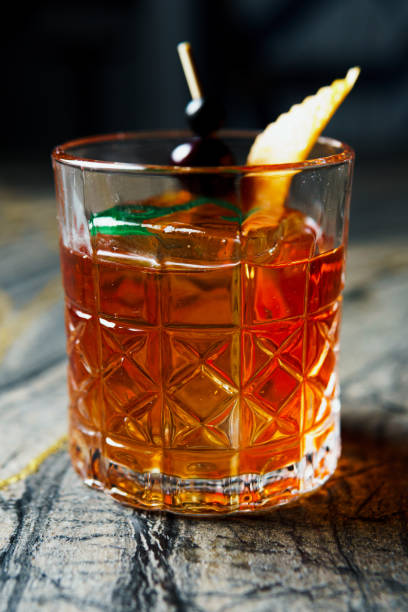 istock Alcoholic drink. A cocktail with elite alcohol on dark black background 2150456420