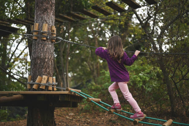 istock Little girl climbing adventure park. 2150456832