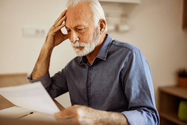 istock Worried senior man analyzing home finances at home 2150457186