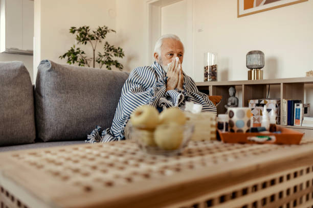 istock Elderly Man Wrapped in a Blanket With a Cold 2150457189