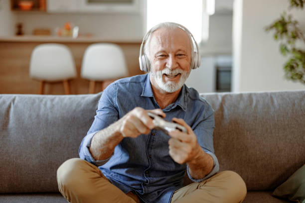 istock One Senior man playing video games on the console 2150457218