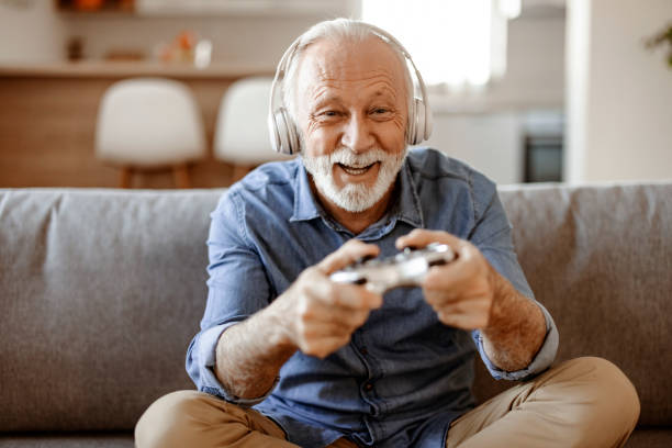 istock One Senior man playing video games on the console 2150457300