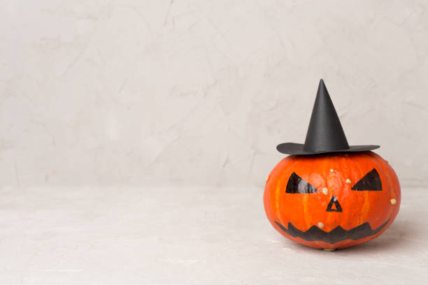 istock Halloween composition with jack o lanter decor on concrete table 2150458279