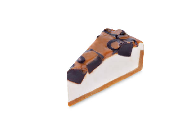 Caramel brownie cheesecake on a white isolated background. toning