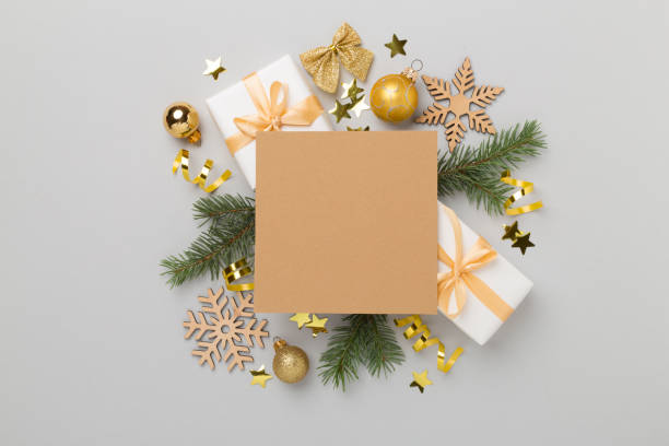istock Greeting card mockup with christmas decor on color background, top view 2150461004