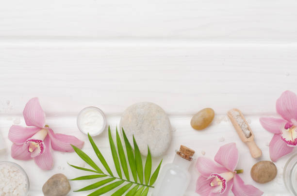 istock Composition with orchids, spa products on wooden background, top view 2150461089