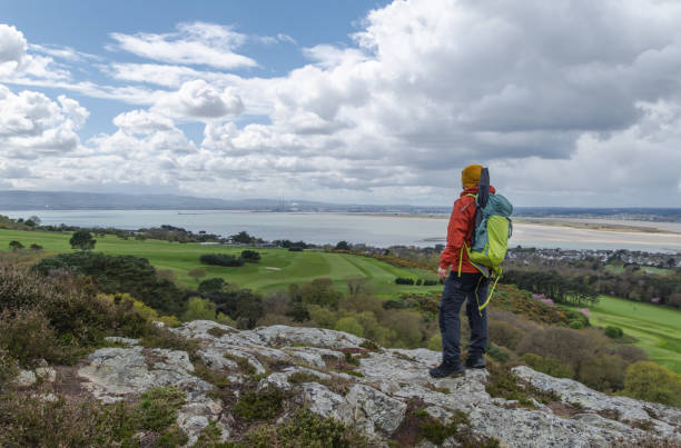 istock Adventurous hiker man in mountain top. 2150464311