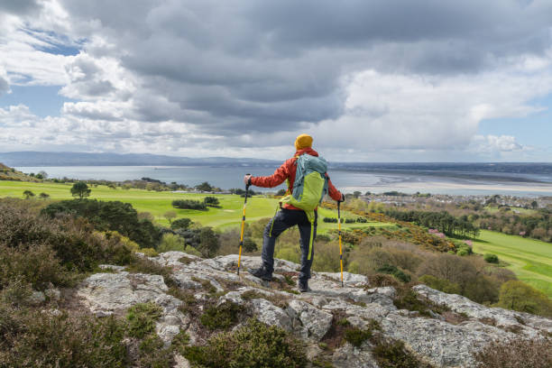 istock Hiking in Ireland, traveler with his backpack. 2150464327