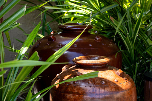 Traditional ceramic clay pots in the garden outdoor, part of UAE heritage. High quality photo.