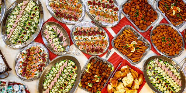 Table with food on plates, top view.