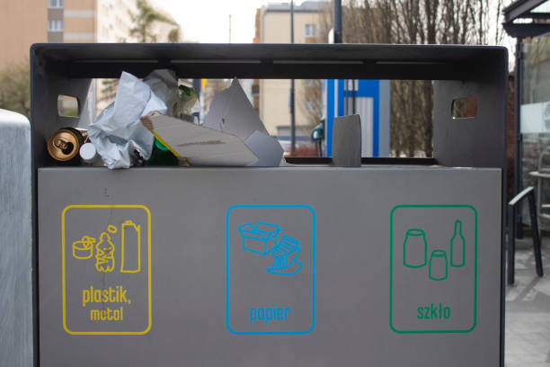 istock Public garbage bin with waste separation on a city street filled with garbage 2150467433