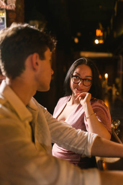 istock Lady arranges next meeting with guy at bar counter 2150468719