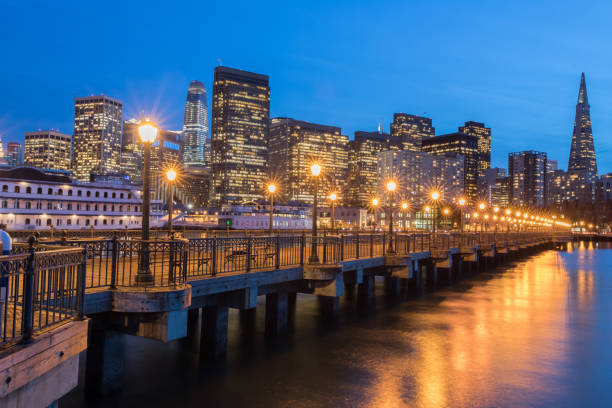 istock Twilight cityscape with illuminated skyscrapers and pier 2150470382