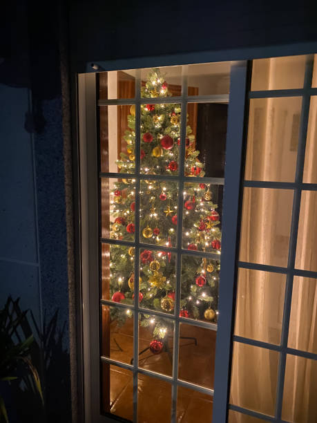 istock View through the window to the Christmas tree 2150478150
